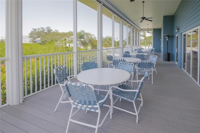 sunroom / solarium with ceiling fan