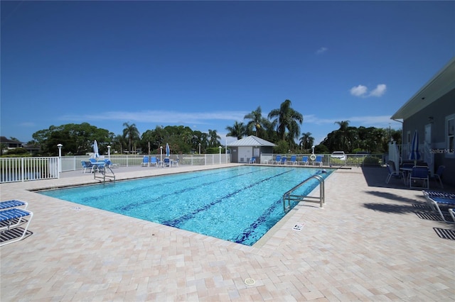 view of swimming pool with a patio