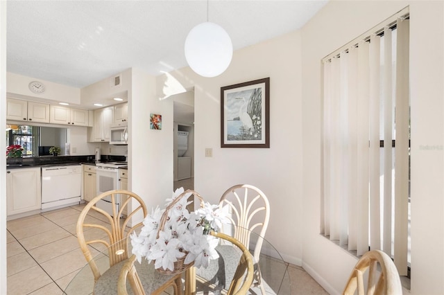 dining space with light tile patterned floors