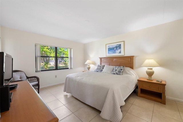 bedroom with light tile patterned floors