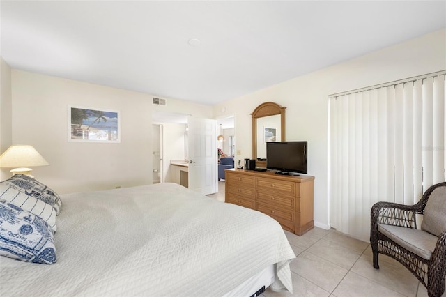 bedroom with light tile patterned floors