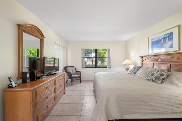 bedroom with light tile patterned floors