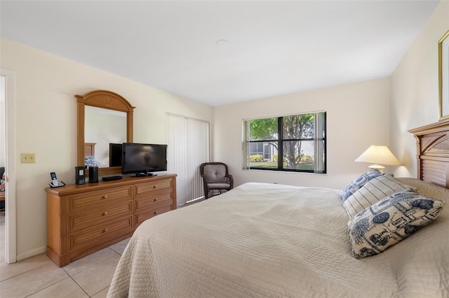 bedroom featuring light tile patterned floors