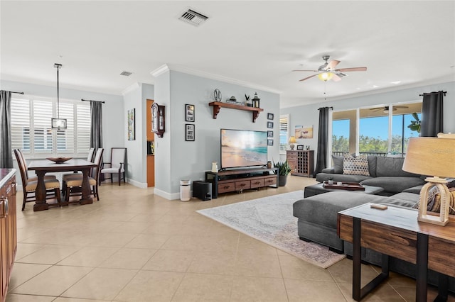 tiled living room with a wealth of natural light, ornamental molding, and ceiling fan