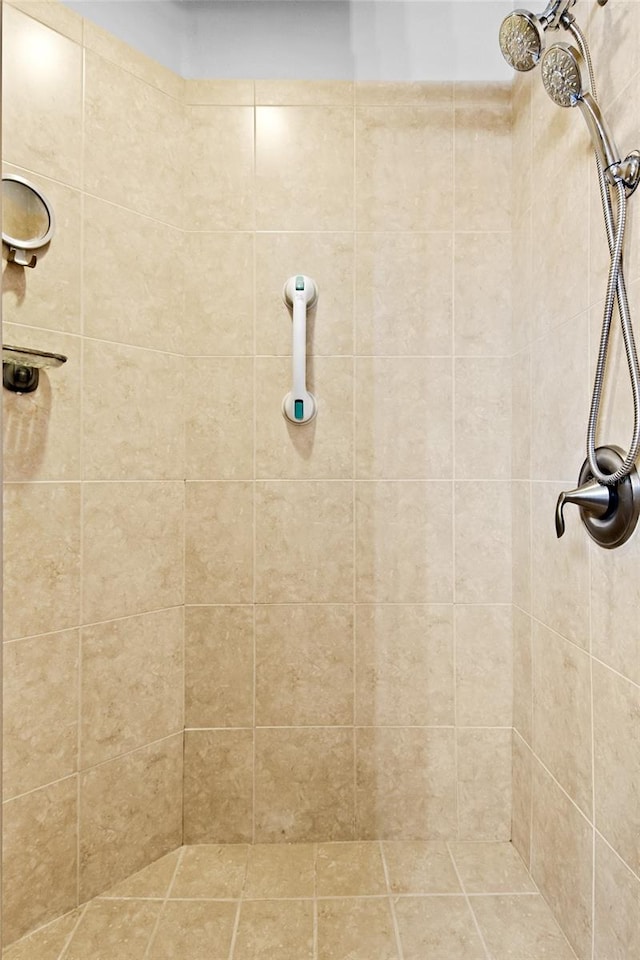 bathroom with tiled shower