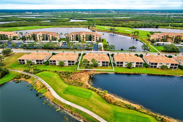 birds eye view of property featuring a water view