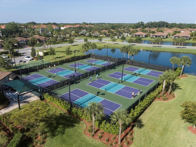 birds eye view of property with a water view