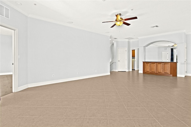 unfurnished living room with ceiling fan, ornamental molding, and light tile patterned floors