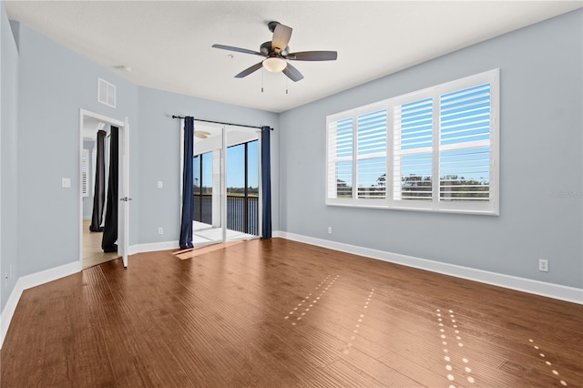 unfurnished room featuring ceiling fan and hardwood / wood-style floors