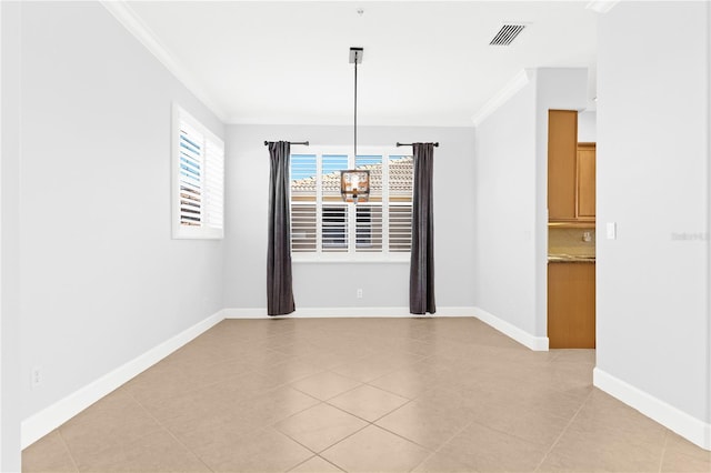 unfurnished dining area featuring crown molding, a chandelier, and light tile patterned floors