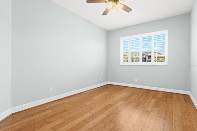 spare room featuring hardwood / wood-style flooring and ceiling fan