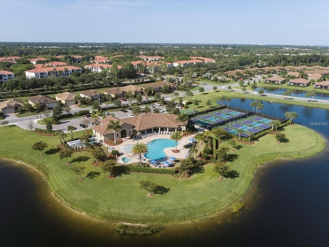 birds eye view of property with a water view