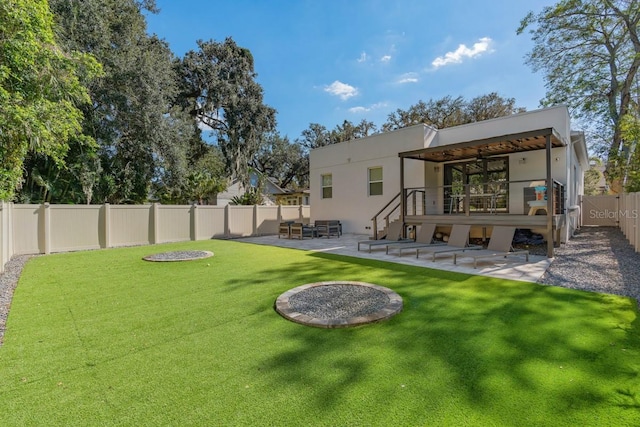 back of property featuring a lawn, outdoor lounge area, and a patio