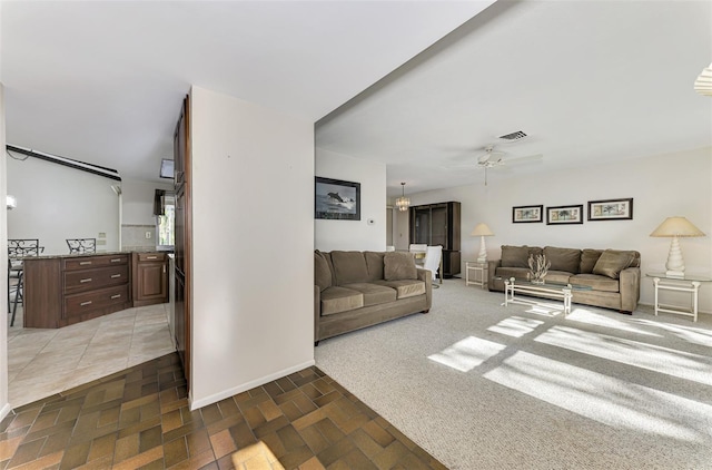 living room with ceiling fan and dark carpet