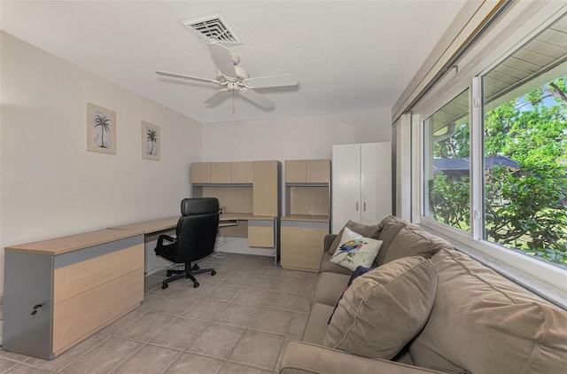 office with ceiling fan and light tile patterned floors