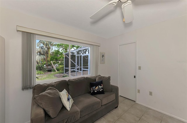 living room with ceiling fan and light tile patterned floors