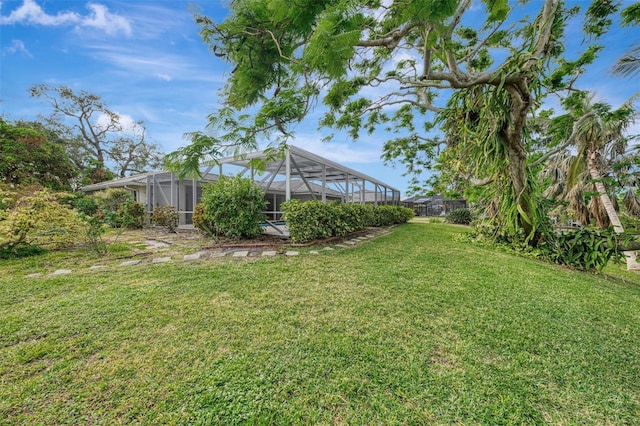 view of yard with a lanai