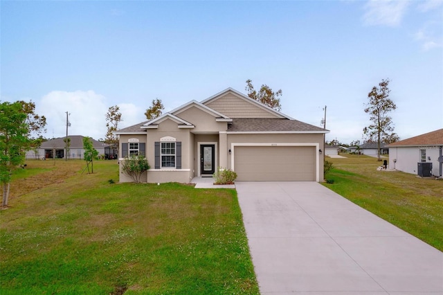 view of front of home with cooling unit, a front yard, and a garage