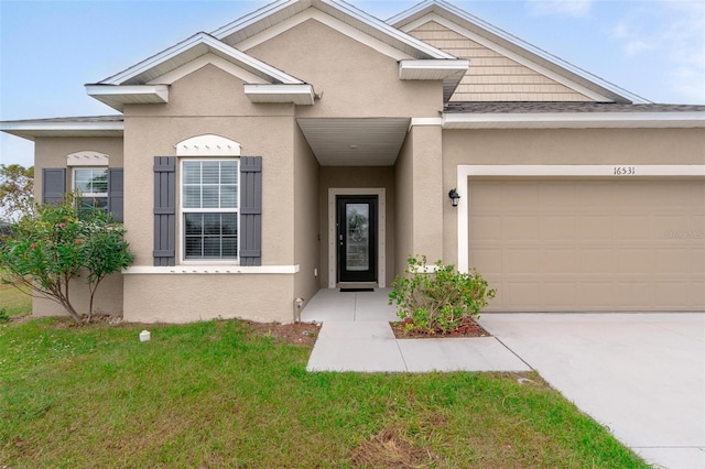 view of front facade featuring a garage and a front lawn