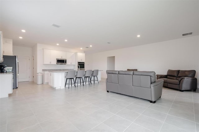 living room with light tile patterned flooring