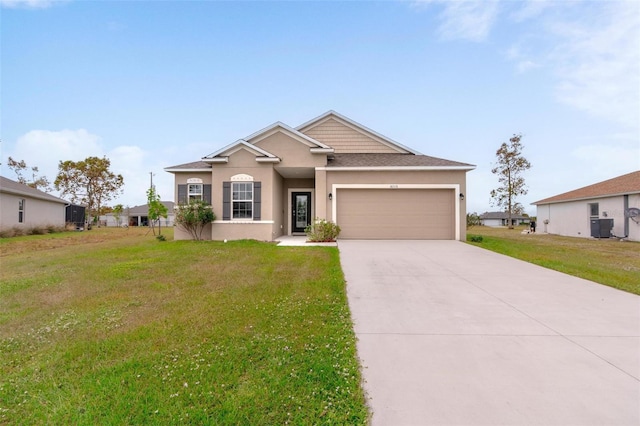 view of front of property featuring a garage and a front lawn