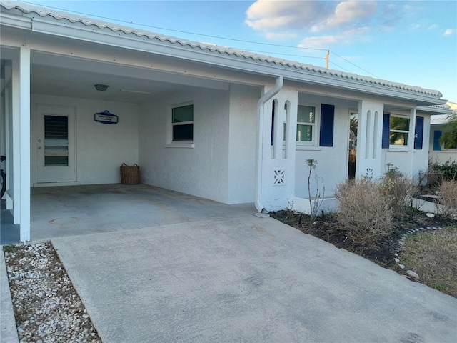 view of front of home featuring a carport