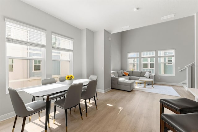 dining area featuring light wood-type flooring