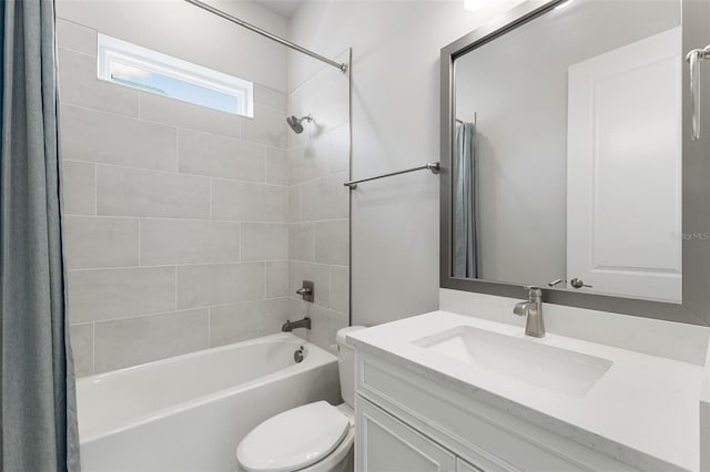 bathroom featuring shower / tub combo, vanity, and toilet