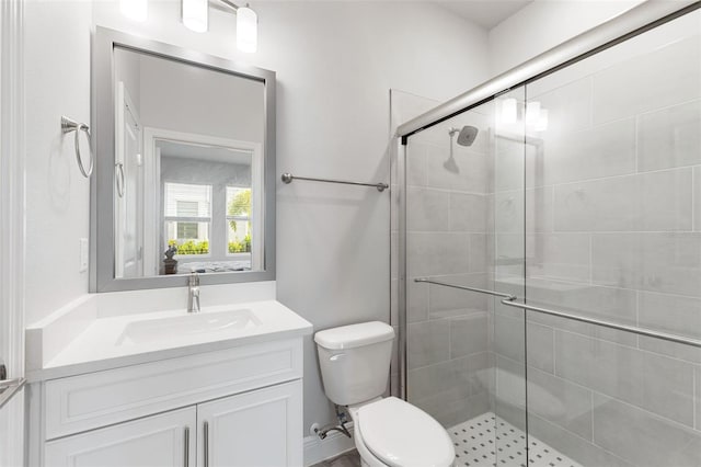 ensuite bathroom with toilet, ensuite bath, a shower stall, and vanity