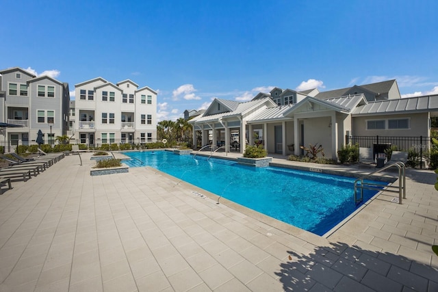 view of swimming pool featuring a patio