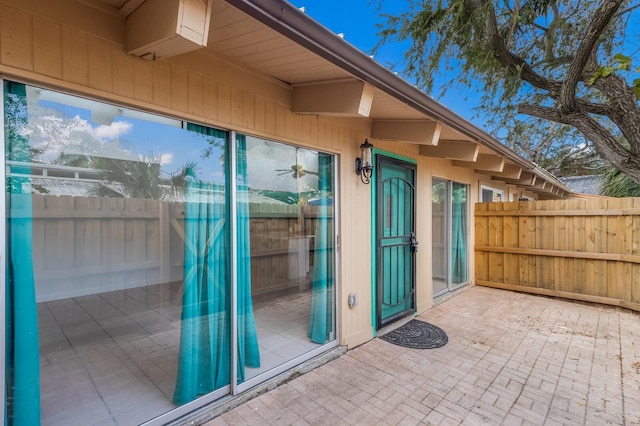 entrance to property featuring a patio