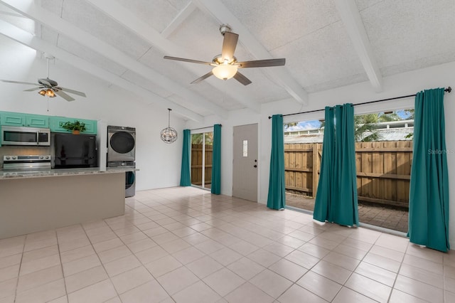 unfurnished living room with light tile patterned floors, vaulted ceiling with beams, ceiling fan, and stacked washer and clothes dryer