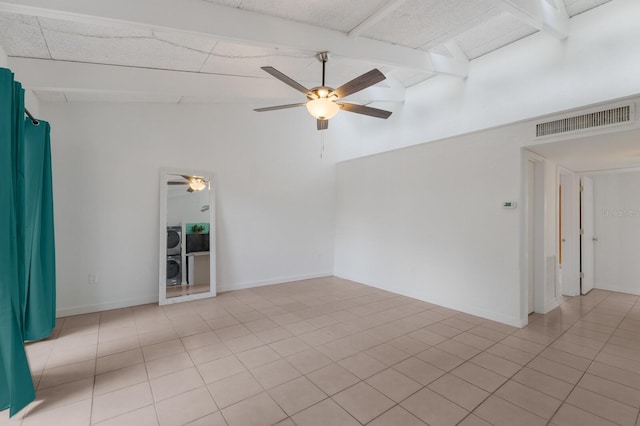 spare room with ceiling fan, light tile patterned flooring, and lofted ceiling with beams