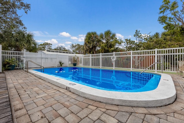 view of pool featuring a patio area