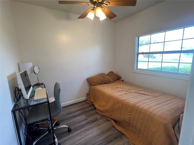 31730 Clay Gully Rd, Myakka City, FL 34251 - bedroom with wood finished floors, an office area, ceiling fan, and baseboards