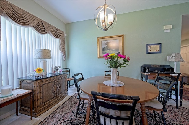 dining area featuring a notable chandelier