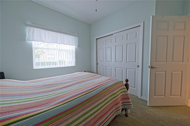 carpeted bedroom with a closet