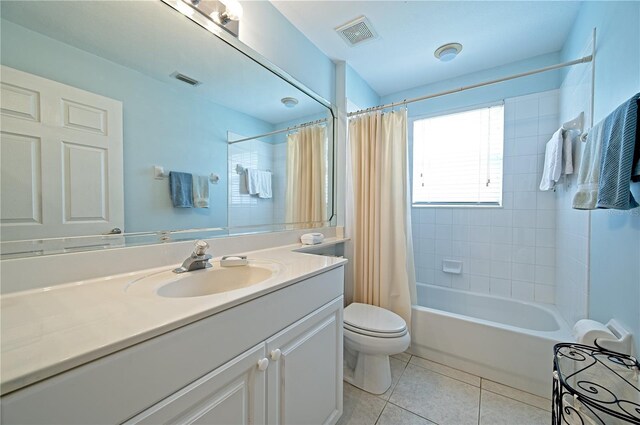 full bathroom with tile patterned floors, shower / bath combination with curtain, toilet, and vanity