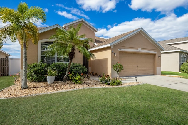 view of front of house with fence, concrete driveway, a front yard, stucco siding, and a garage