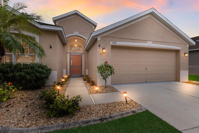 single story home featuring a garage