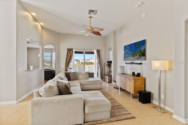 living room with ceiling fan and light tile patterned flooring