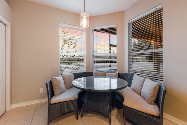 dining space with light tile patterned floors