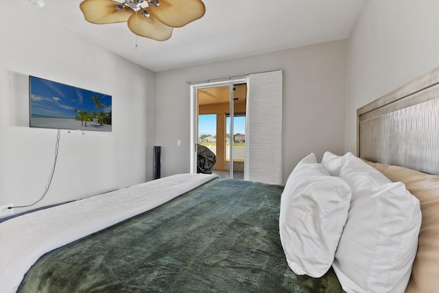 carpeted bedroom featuring access to exterior and ceiling fan