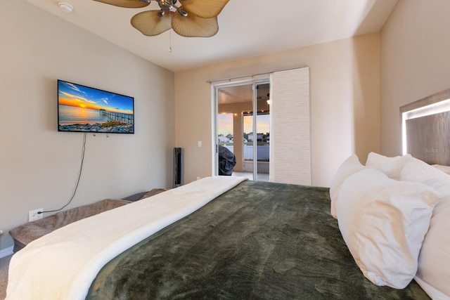 carpeted bedroom featuring ceiling fan and access to outside