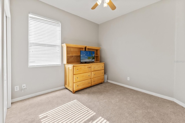 bedroom with light colored carpet and ceiling fan