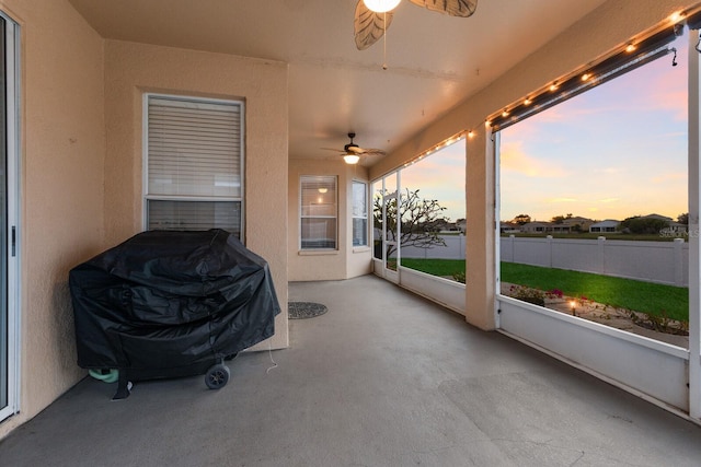 sunroom / solarium with ceiling fan