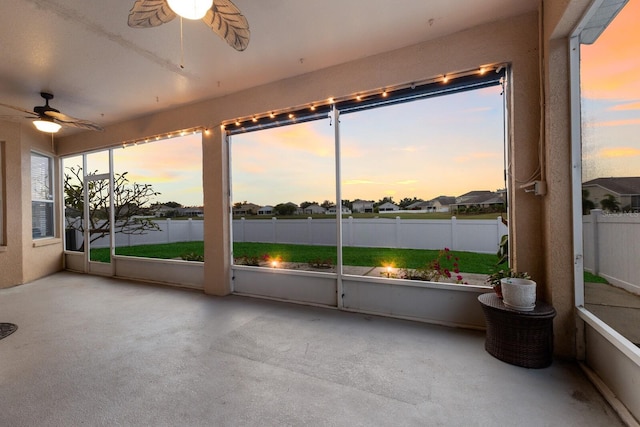 sunroom with plenty of natural light and ceiling fan