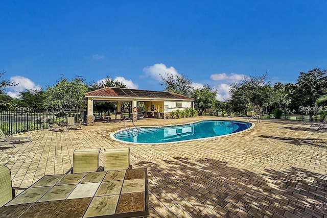 view of pool featuring a patio