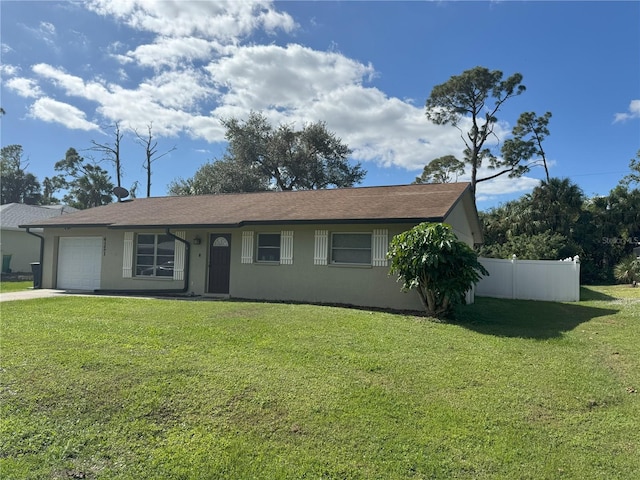 ranch-style home with a front yard and a garage