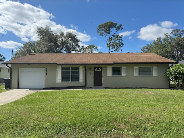 ranch-style house featuring a front lawn and a garage